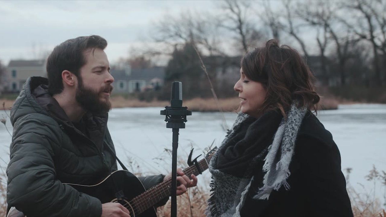 Two singers by a frozen lake