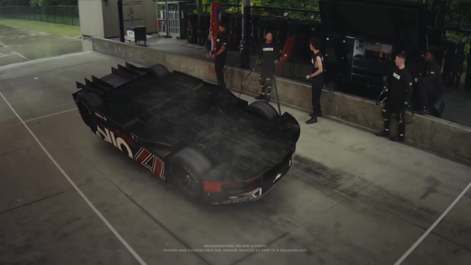 Black race car seen from above